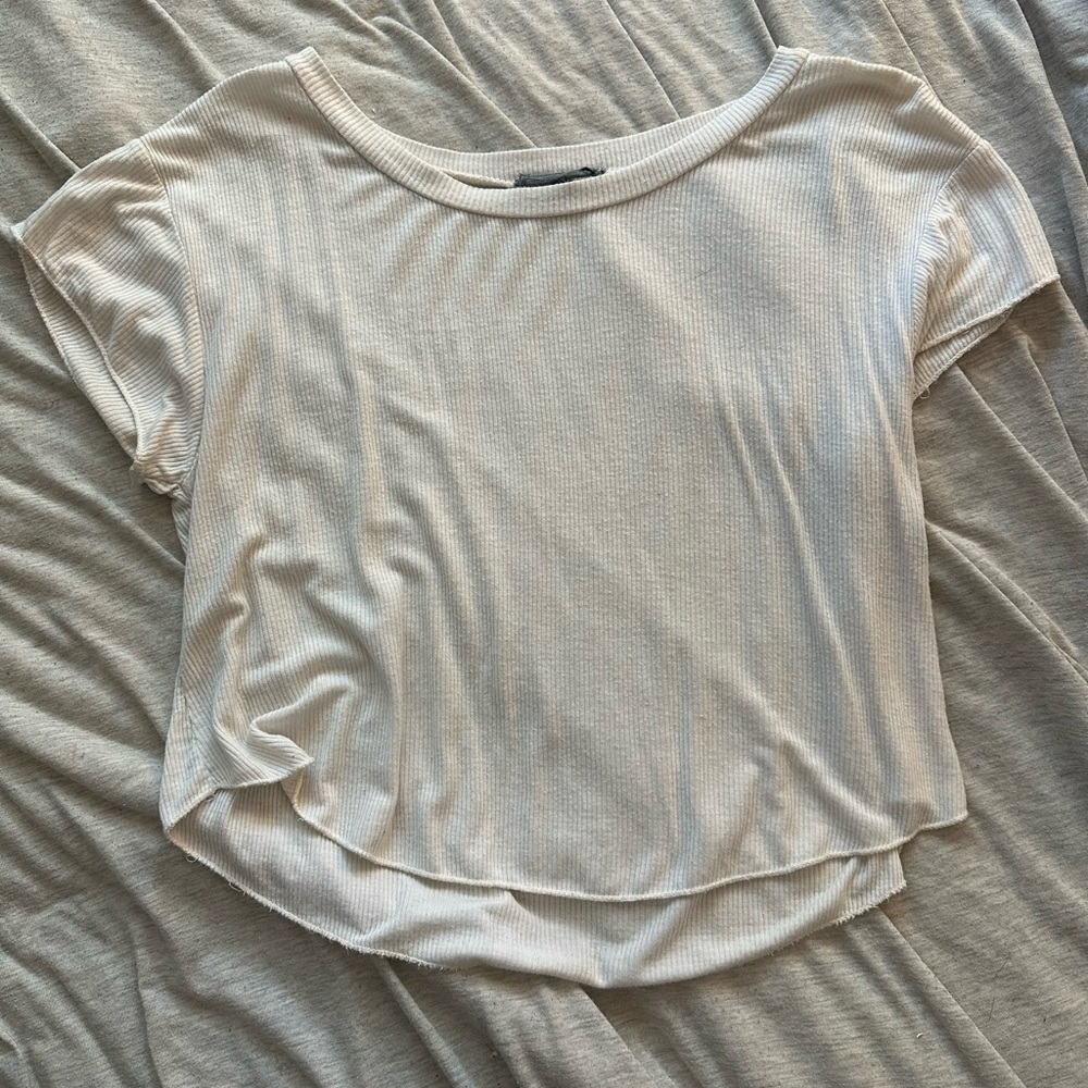 Garage ribbed, white cropped T-shirt. Has rounded cut at the bottom. Size Small